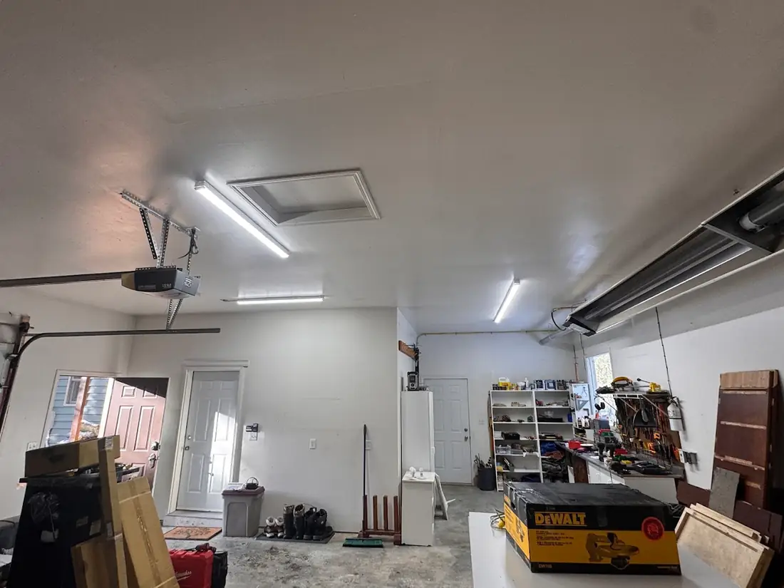 Garage with linear LED fixtures fitted across the ceiling
