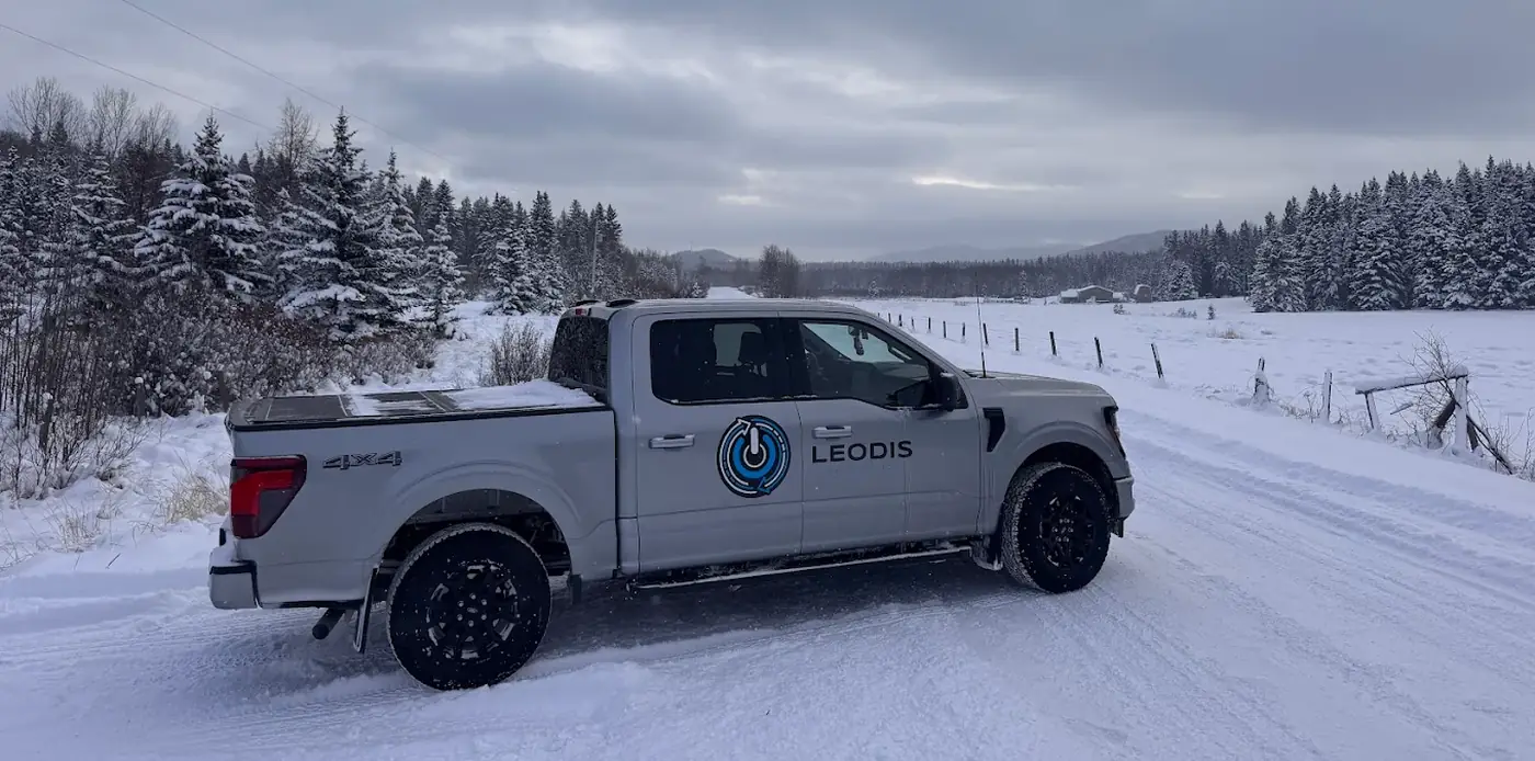 Leodis Electrical Group truck parked on a snow covered rural road